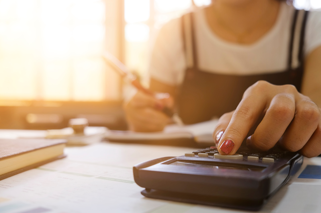 Fingers on calculator