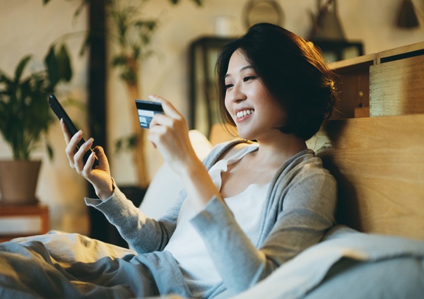 CardHub_ImageC Woman on phone with card
